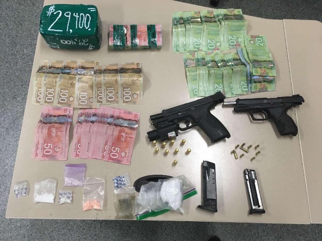 Police Seize Drugs Guns And Cash During Traffic Stop On Hwy 400