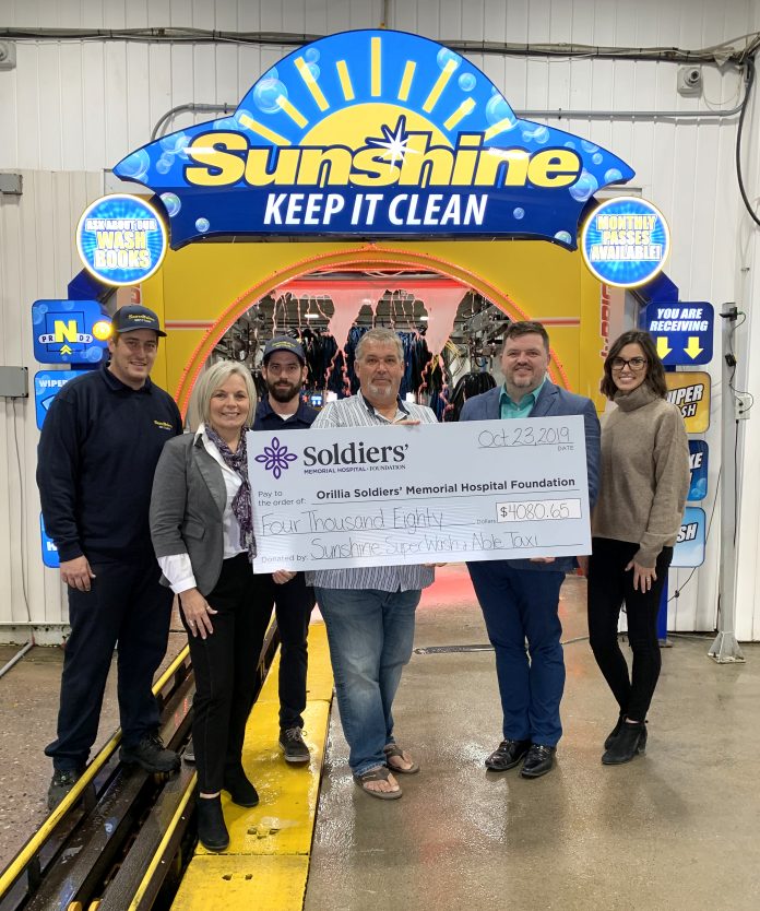 Sunshine Super Wash Presents Cheque to Soldiers'