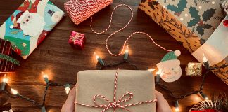 A gift wrapped up alongside other holiday decorations