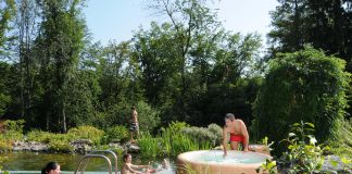A family using their Softub, a portable hot tub.