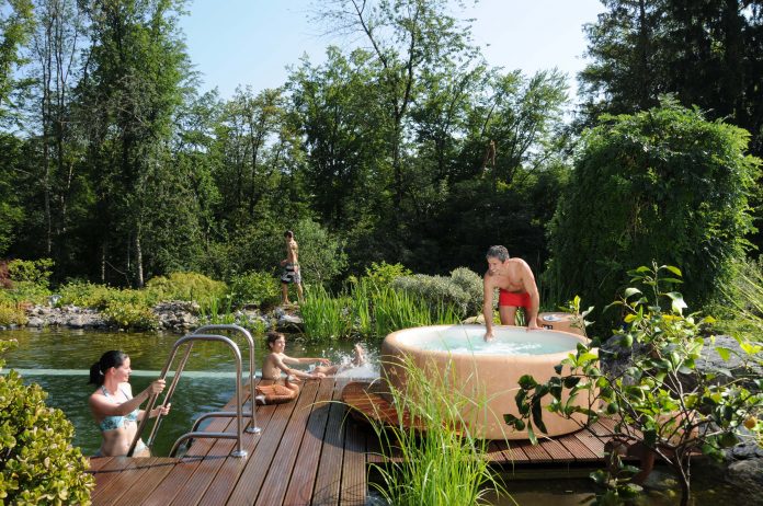 A family using their Softub, a portable hot tub.