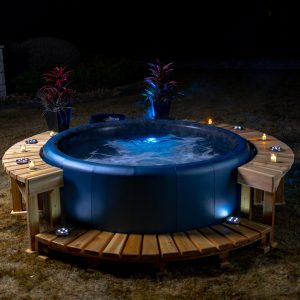 A Softub lit up at night.