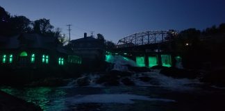The Bracebridge waterfalls lit up teal for Tourette Syndrome Awareness Month