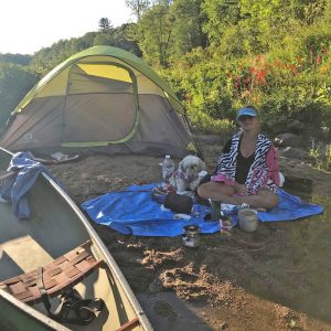 Port Carling teen Cailan Punnewaert and her dog Tinkerbell camping during their 2020 paddle for Aspen Valley