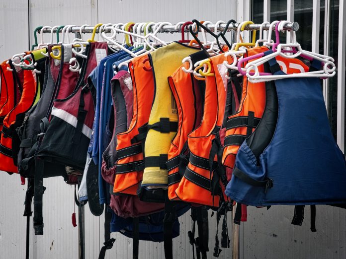 A row of lifejackets. The Lifesaving Society reminds Ontarians to always wear PFDs while boating.