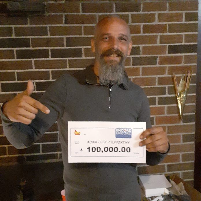 ENCORE winner Adam Samms of Kilworthy with his $100,000 cheque