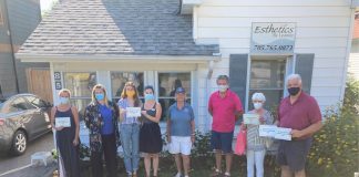 Historic Home Plaque presentation: Susan Daglish of the Muskoka Lakes Museum and Muskoka Lakes Mayor Phil Harding are joined by homeowners involved in the historic plaque program.