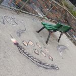Orange ribbons and chalk art in honour of Indigenous children who died in residential schools