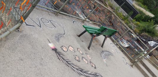 Orange ribbons and chalk art in honour of Indigenous children who died in residential schools