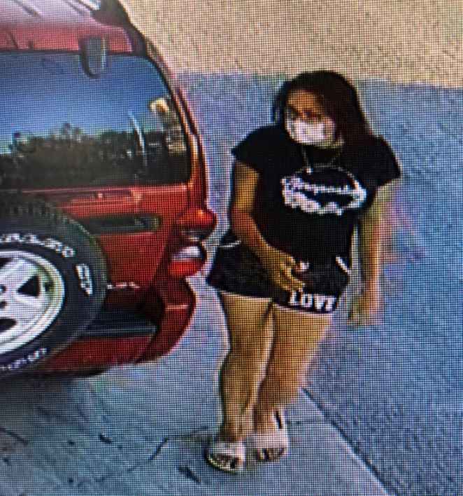 Theft of red Jeep Liberty: Female suspect wearing a black shirt, black shorts with 
