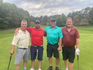 Griff Hookings' stepdad Steve Roche at the tournament with Aaron Bustard, Mike Hansen and Steve Smith