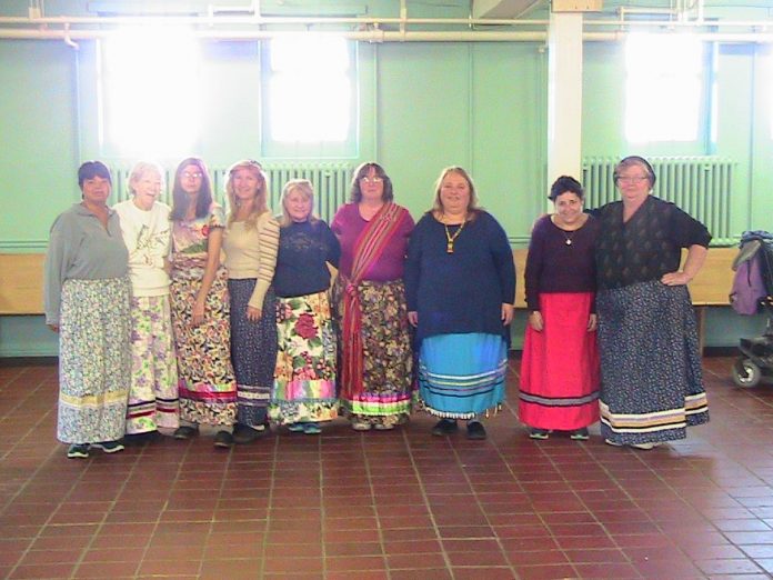 Members of the Muskoka Indigenous Friendship Community wearing the ribbon skirts they made