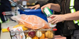 A basket is filled with food items at a Toronto food bank.