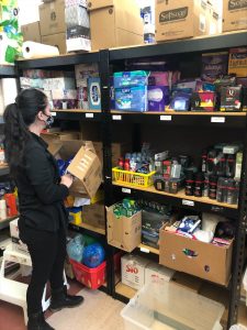Family Services Associate Naomi Kelly stocking shelves in the hygiene area of the Salvation Army's Gravenhurst food bank. Alongside the need for food, hygiene items like tissues, period products and toiletries also in high demand