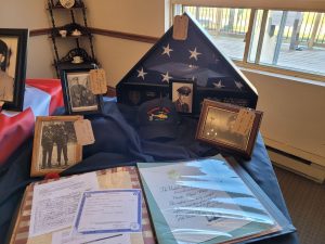 Residents and staff display photos and memorabilia from their loved ones that served in the military