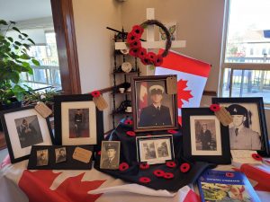 Residents and staff display photos and memorabilia from their loved ones that served in the military