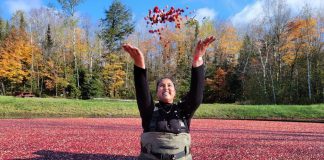 Bala Cranberry Festival-goer Sureka Vishnumoorthy throws cranberries in the air at Muskoka Lakes Farm & Winery