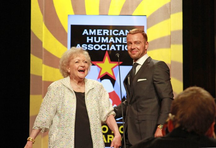 Betty White and Joey Lawrence introducing the Guide Dog category at the American Humane Association Hero Dog Awards in 2012