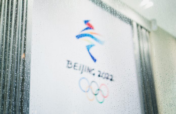 Beijing 2022 Olympic logo through a rainy pane of glass