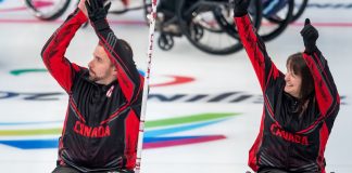 Jon Thurston and Ina Forrest celebrate after Canada advances to the semifinals in wheelchair curling. Photo courtesy of the Canadian Paralympic Committee