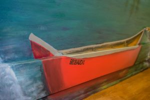 The red canoe in the mural at the Pines.