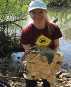 Sue Carstairs, executive and medical director of the Ontario Turtle Conservation Centre, with a snapping turtle