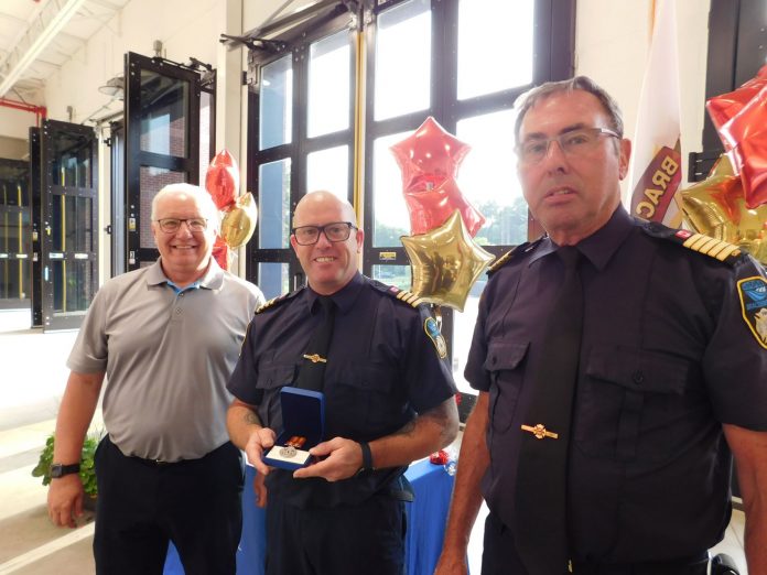 Bracebridge Deputy Mayor Rick Maloney, Deputy Fire Chief Mike Peake and Fire Chief Murray Medley at the awards ceremony on June 15