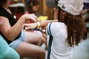 A camp injecting insulin. Photo courtesy of Camp Huronda