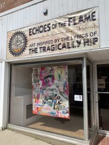 Gord Downie painting in window front