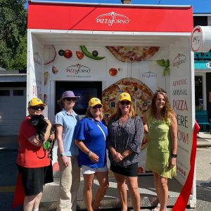 24/7 pizzas: Port Severn General Store owner Roni Carli (right) with members of the Baxter Ward Lions Club at the new machine