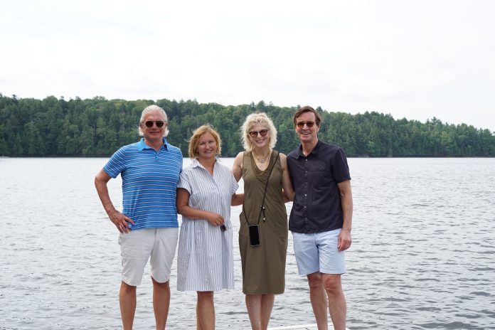Seth Mersky, Theresa Mersky, Karen Lang and Don Lang stand together in view of the new Highlands Island Nature Reserve on Lake Rosseau. Photo courtesy of Muskoka Conservancy