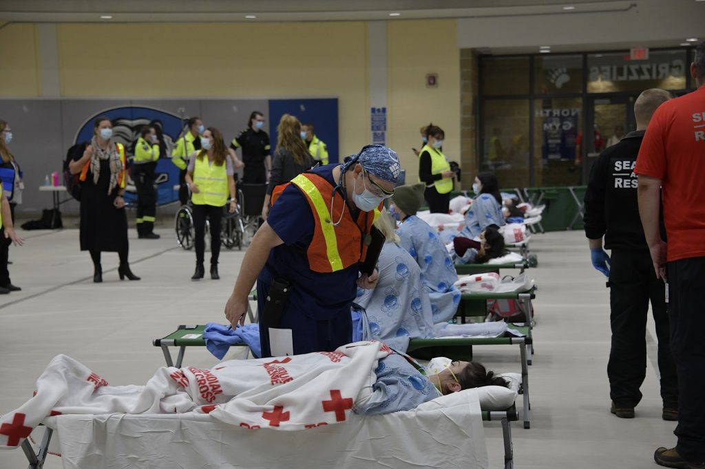 Dr. Derek Benjamin, Chief of Medicine, who volunteered to participate in the exercise is seen caring for a “patient” during the exercise