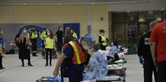Dr. Derek Benjamin, Chief of Medicine, who volunteered to participate in the exercise is seen caring for a “patient” during the exercise