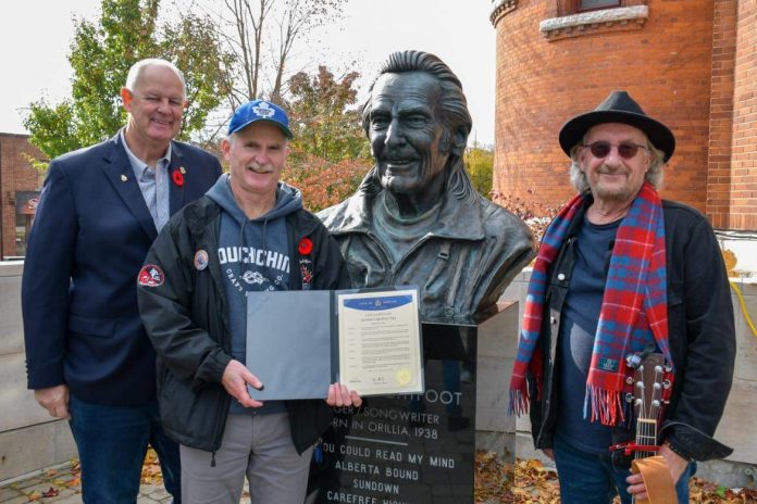 Orillia Mayor Don McIsaac, festival committee president John Winchester and committee member Steve Porter at the Gordon Lightfoot Day Proclamation in 2023
