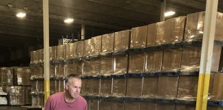 Volunteer Mike Elchyshyn helping load the skids of donations for the Shoebox Raiser on the truck at Cavalier Logistics in Bolton.