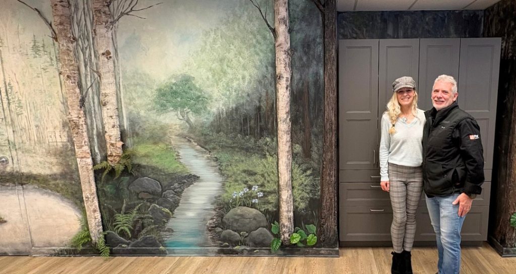 Mural artist Kimberly Rideout and Quinn Spencer from Bracebridge Home Depot at the Alzheimer Society of Muskoka