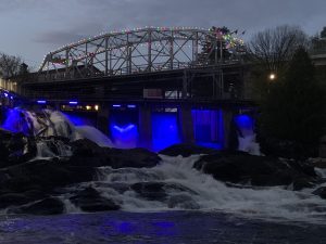 Bracebridge Falls illuminated blue for Apraxia Awareness Day