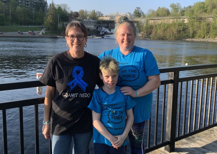 Nash Hamilton (front) with his grandmother and mother Jody at Bracebridge Falls for Apraxia Awareness Day