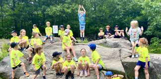 Kids Run Club participants in their neon yellow group t-shirts