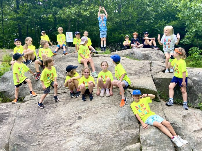 Kids Run Club participants in their neon yellow group t-shirts