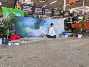 Kimberly Rideout painting a submission mural at Home Depot Bracebridge. Photo by Pamela Ewert.