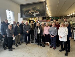 Manna Food Bank in Bracebridge, Ont., unveils a mural by local artist Kimberly Rideout. Volunteers and community leaders gathered for the celebration, including Brian Bobbette, Debbie Vernon, Rick Maloney, Barry Hammond, Dan Lensen and Bonnie Paterson.