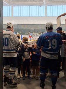 McDonald's Hockey Team Player left, Boston Pizza's Hockey Team Player right.