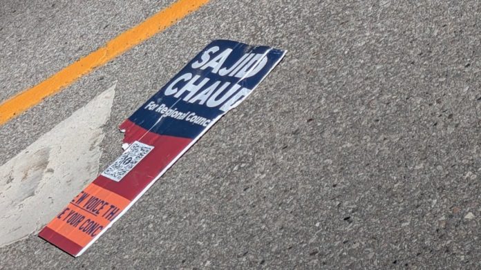damaged election sign